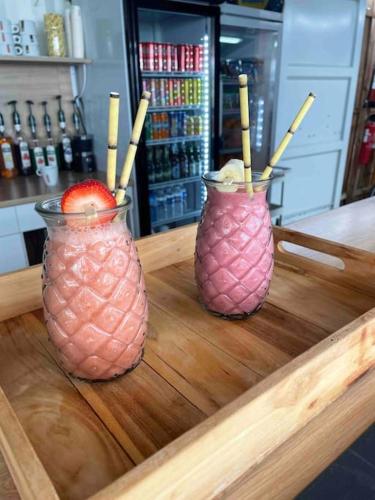 two vases sitting on top of a wooden tray at Torreilles-Casa terracota-plage - visa image- les déferlantes le Barcares - South of France in Torreilles