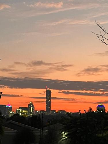 a sunset view of a city at sunset at Matina Guest House in Johannesburg