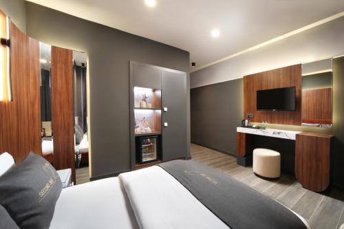 Ένα ή περισσότερα κρεβάτια σε δωμάτιο στο Second Suit Hotel