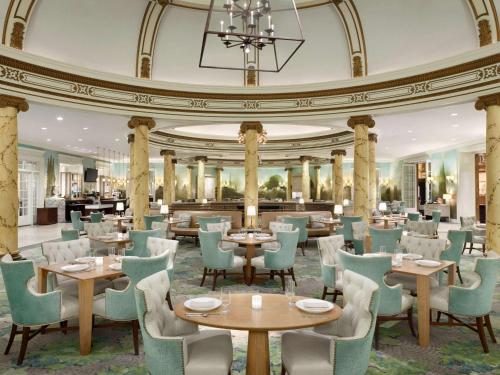 a restaurant with tables and chairs and a ceiling at Fairmont San Francisco in San Francisco