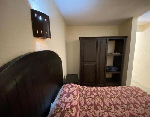 Postel nebo postele na pokoji v ubytování Hotel D´ Alba