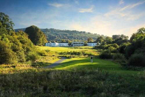 a man is standing on a golf course at Tully's Home, Tulfarris Village, Wicklow in Blessington