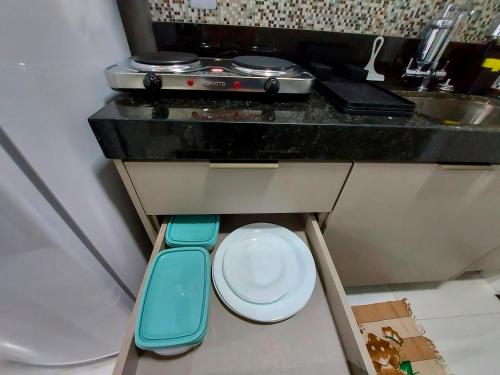 a small kitchen with a toilet and a sink at Flat Comfort Vista Mare Studios - Intermares in Cabedelo