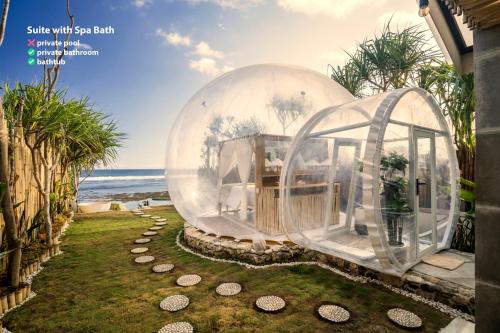 two glass domes on the side of a house at Bubble Hotel Nyang Nyang - Adults only in Uluwatu