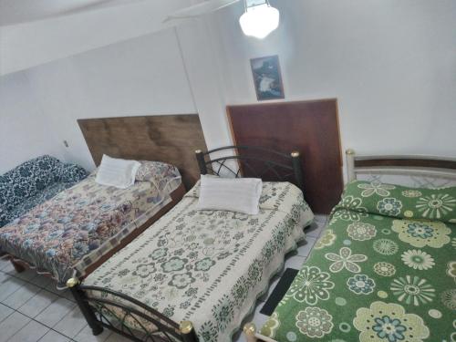 Postel nebo postele na pokoji v ubytování Hotel Las Palomas