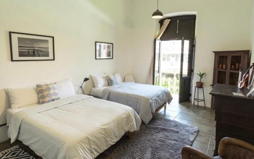 Ένα ή περισσότερα κρεβάτια σε δωμάτιο στο Casa Ibarra