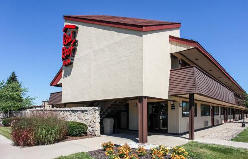 a building with a krispy kreme sign on it at Red Roof Inn Michigan City in Michigan City