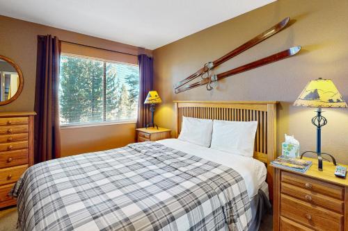 a bedroom with a large bed and a window at View Condo at Northstar in Truckee