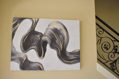 a painting is hanging on a wall at Villa Luna in Gig Harbor