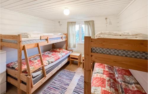 a bedroom with two bunk beds and a window at Awesome Home In yer With House A Mountain View in Øyer