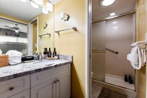 a bathroom with a sink and a shower at Sugar Beach Resort 531- Direct oceanfront gem at Sugar Beach Resort in Kihei