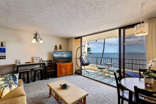 a living room with a view of the ocean at Sugar Beach Resort 531- Direct oceanfront gem at Sugar Beach Resort in Kihei