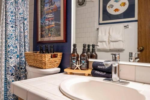 a bathroom with a sink and a toilet at Kihei Alii Kai D207- Ocean view, walk to shops, dining, and Kam I Beach in Kihei
