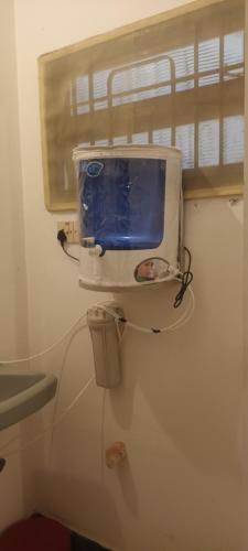 a bathroom with a sink and a toilet with a window at Villa Felicia 1BHk property with Kitchen and Modern Amenities in Puducherry