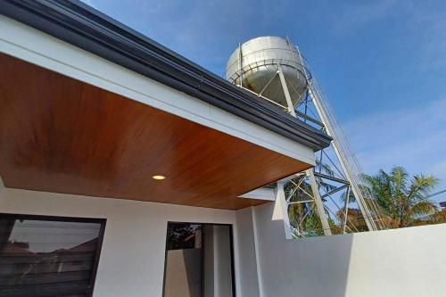 a water tower on the roof of a house at Home in Bacolod in Bacolod