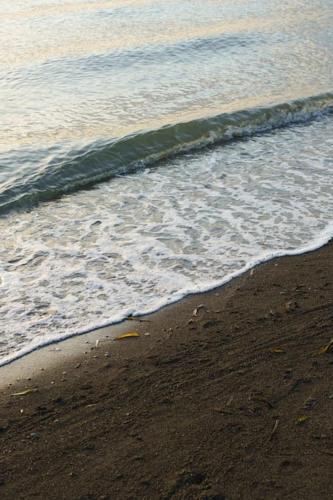 a beach with the ocean and the shoreline at Seacove Villa w/ Heated Jacuzzi in Laiya Batangas in San Juan
