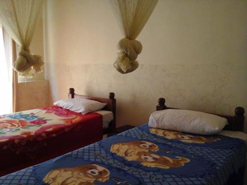 Postel nebo postele na pokoji v ubytování Majestic Tourist Hotel
