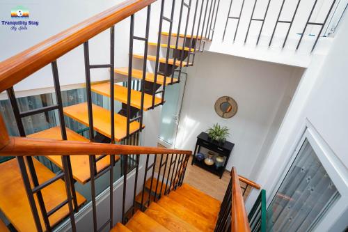 an open staircase with yellow seats in a house at Tranquility Stay Old Quarter in Hanoi