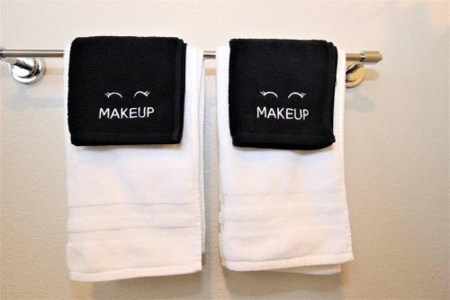 two towels are hanging on a towel rack at Secluded & Quiet Guest House-Cherry Valley-Morongo in Cherry Valley