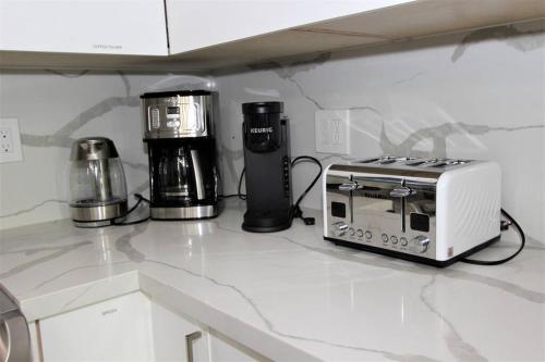 a kitchen counter with a toaster and a toaster at New & Modern with Accessibility-Family Friendly in San Bernardino