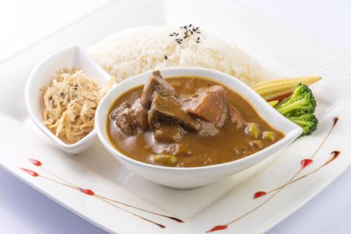 a plate of food with a bowl of soup and rice at Hui-Lai Resorts in Jianshi