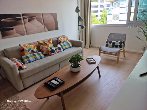 a living room with a couch and a coffee table at City Center Apartment in Nicosia