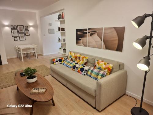 a living room with a couch and a table at City Center Apartment in Nicosia