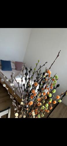 a vase with many different colored flowers in a room at St Andrews Mansions in London