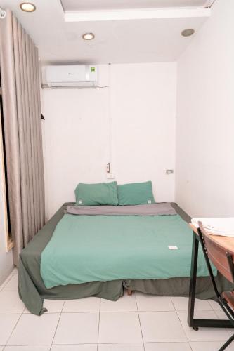 Ένα ή περισσότερα κρεβάτια σε δωμάτιο στο Tam An HaNoi Homestay