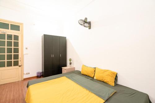 Ένα ή περισσότερα κρεβάτια σε δωμάτιο στο Tam An HaNoi Homestay