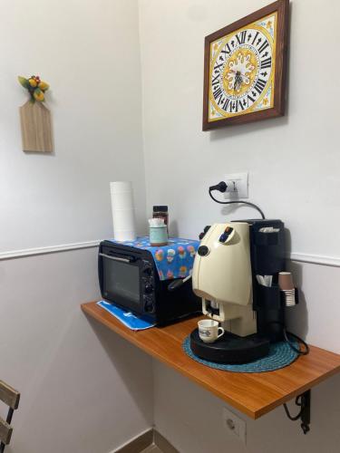 a counter with a coffee maker on a table at Mahalo in Naples