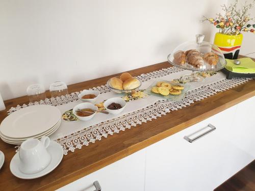 a table with a tray of food on it at B&B Villa Ghira Como in Tavernerio