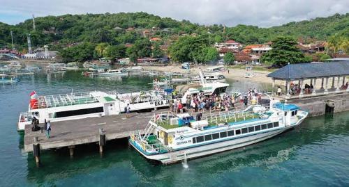 a large boat is docked at a dock at Gili Ferries ticket in Padangbai