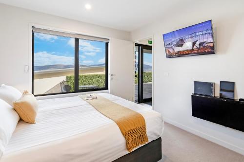 Ένα ή περισσότερα κρεβάτια σε δωμάτιο στο Oceana B&B