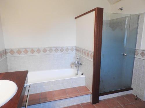 a bathroom with a bath tub and a shower at Holiday Home Finca SANT JAUME in Alaior