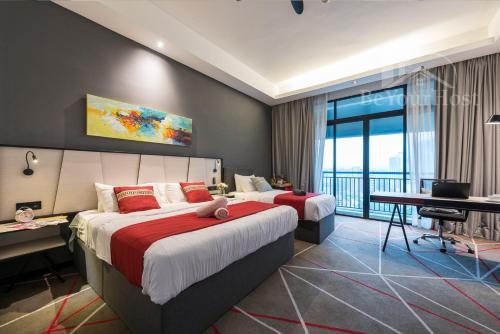 a hotel room with two beds and a balcony at Maison 101 Dang Wangi Kuala Lumpur KLCC in Kuala Lumpur