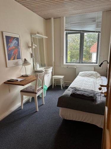 Postel nebo postele na pokoji v ubytování Grenaa Hostel
