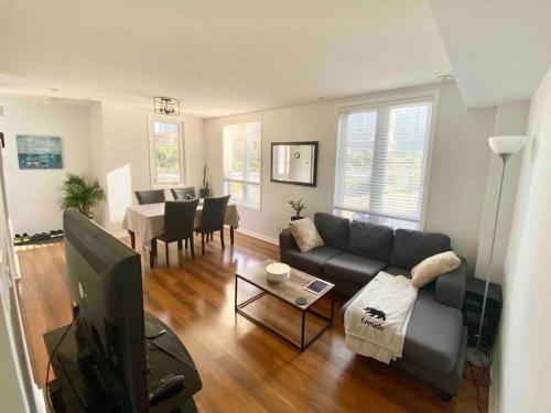 a living room with a couch and a table at King West Private Rooftop Retreat in Toronto