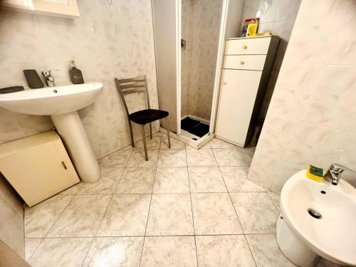 a bathroom with a sink and a toilet at Suite Romolo Moreno 88 - Sanremo in Sanremo
