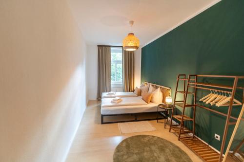 Katil atau katil-katil dalam bilik di RR - Comfortable Apartment 60 qm - Central - WIFI
