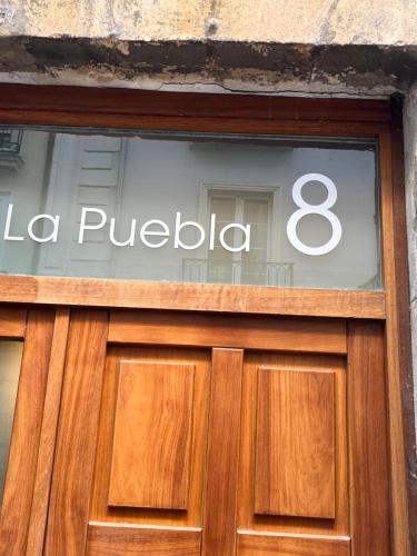 a sign over the door of a store at El Mirador De La Puebla Vut ATUAIRE Parking Incluido in Burgos