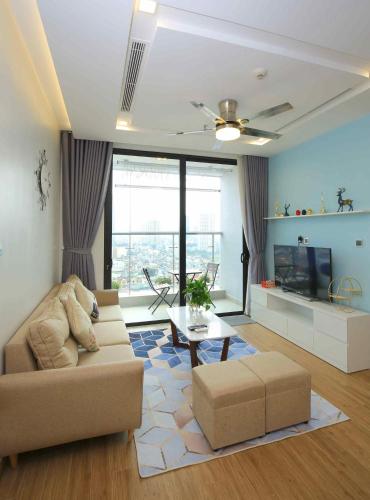 a living room with a couch and a tv at Investland- Vinhomes Metropolis one, two, three, four bedrooms in Hanoi