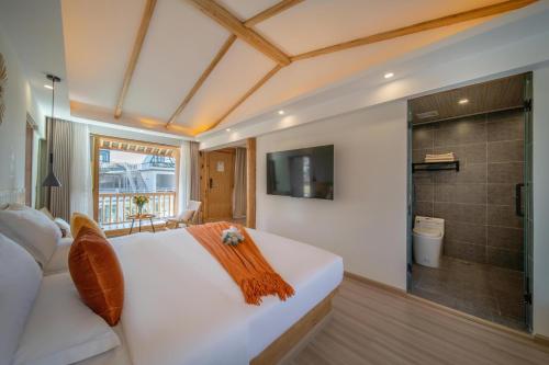 a bedroom with a large white bed and a shower at Viewing Mount with Jun in Lijiang