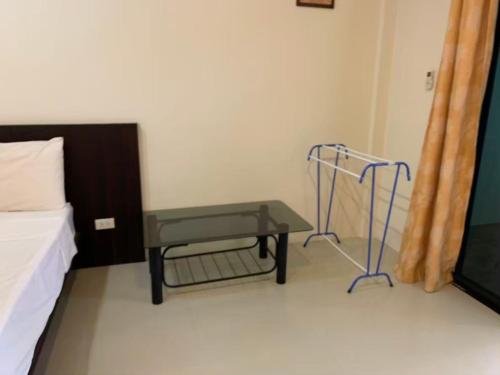 a hospital room with a bed and a table at Dow Residance in Koh Samui 