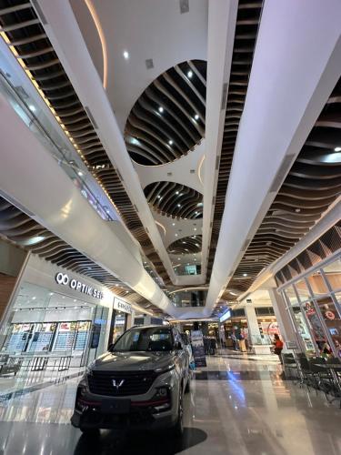 a car parked in the middle of a shopping mall at Apartmen Sea View Lampung Mall 