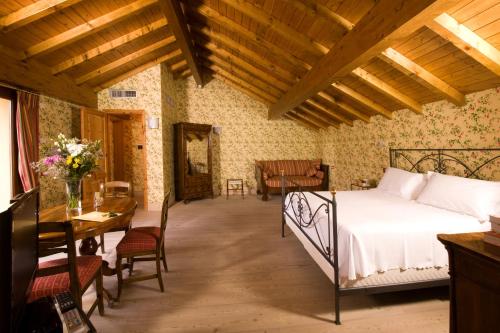 מיטה או מיטות בחדר ב-La Locanda Del Notaio