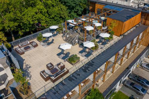 an overhead view of a patio with chairs and umbrellas at Bristol Art & Medical SPA in Busko-Zdrój