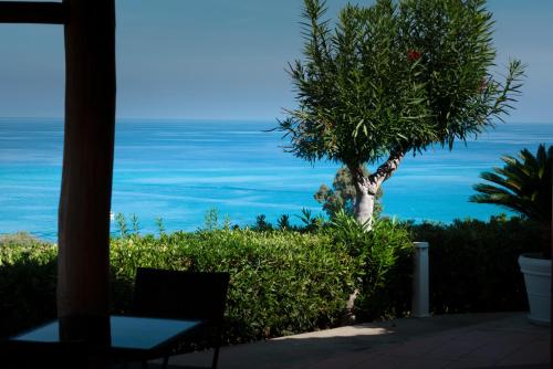 a view of the ocean from a house at Residence New Paradise in Tropea
