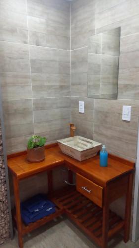 a bathroom with a wooden table with a sink at Don Pedro in San Carlos