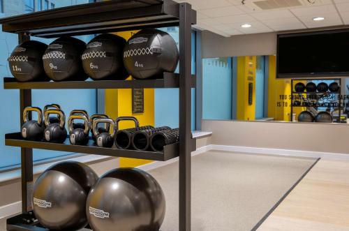 a room with a bunch of football helmets on a shelf at Hampton By Hilton Bath City in Bath